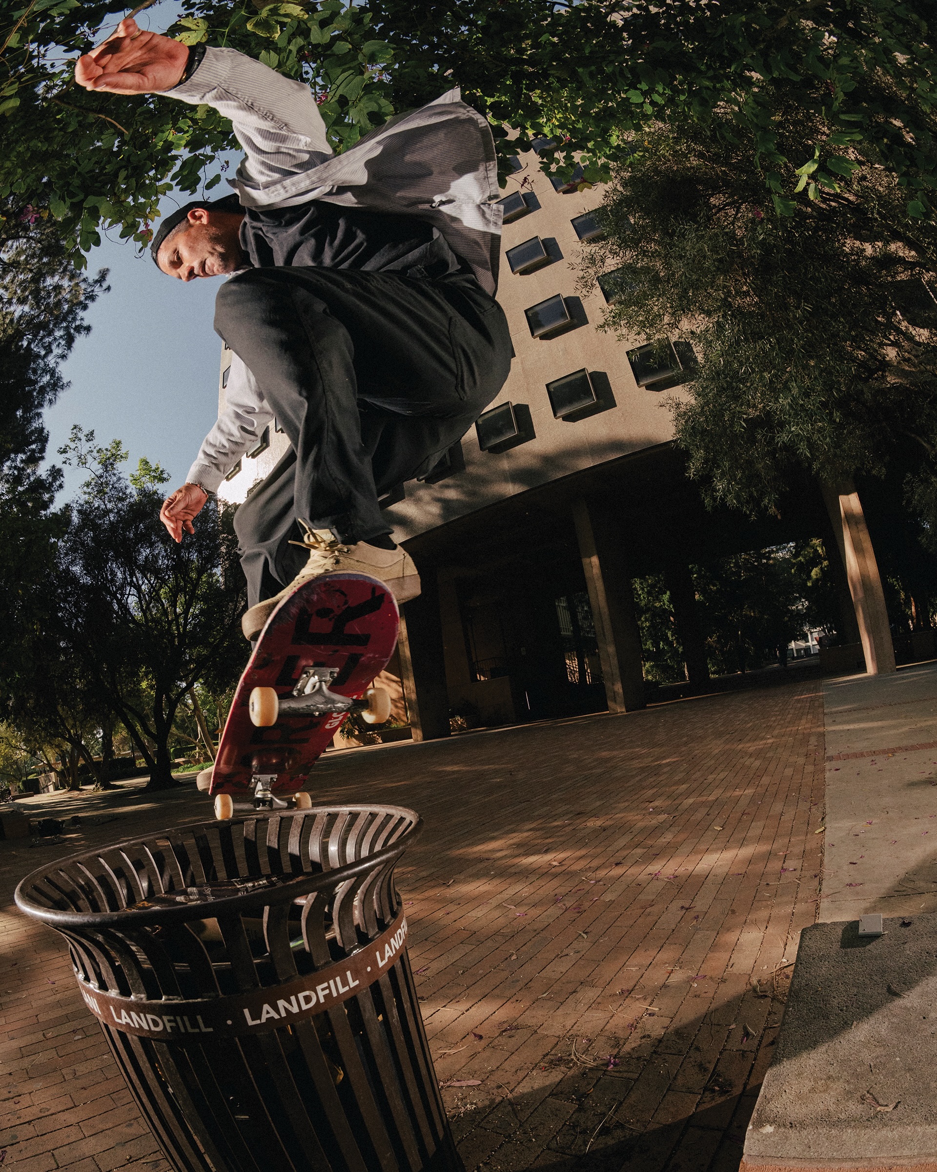 Skateboarder jumping an obstacle in the city